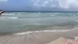 Ankunft am Strand und symboli…